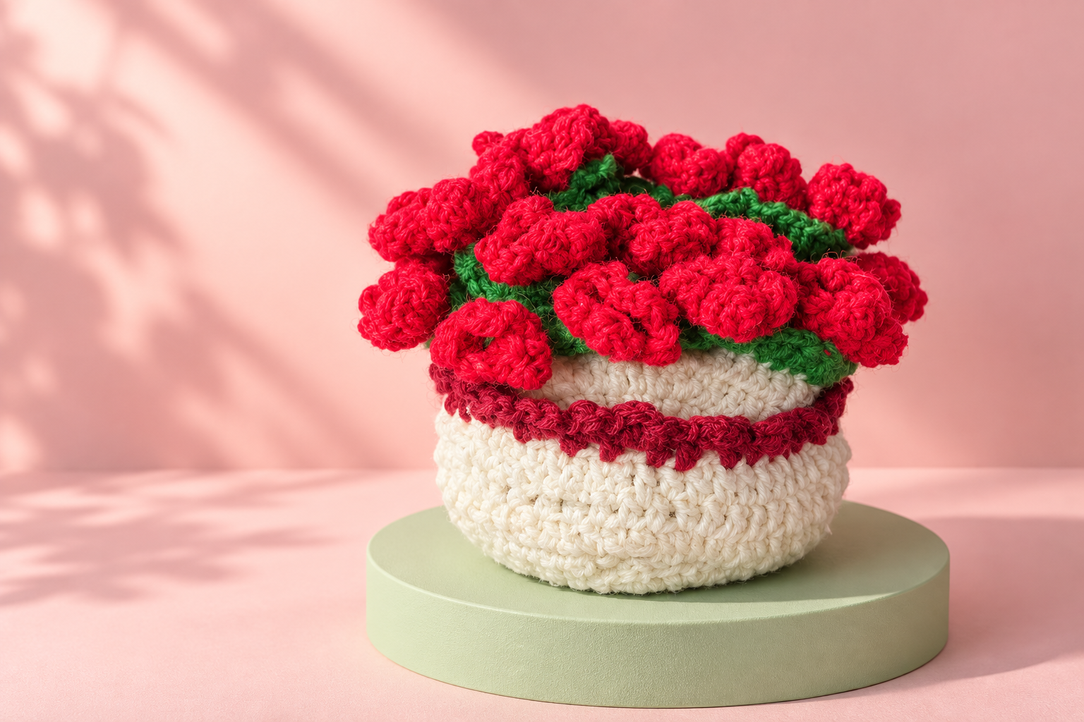 Haya’s red floral crochet piece styled in a soft pink studio